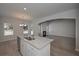 Open kitchen featuring granite countertops, stainless appliances and plenty of sunlight at 490 Charleston Pl, Villa Rica, GA 30180