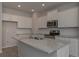 Stylish kitchen with stainless steel appliances, granite counters, and center island at 490 Charleston Pl, Villa Rica, GA 30180