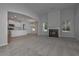Spacious living room with fireplace, large windows, and open view to kitchen at 490 Charleston Pl, Villa Rica, GA 30180