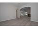 Open-concept living room boasts wood-look floors and archway views into other rooms at 490 Charleston Pl, Villa Rica, GA 30180