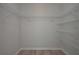 Spacious walk-in closet with ample shelving for organized storage and convenience at 490 Charleston Pl, Villa Rica, GA 30180