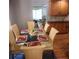 Dining area features a glass table with seating for six and hardwood flooring at 976 Bakers Bridge Rd, Douglasville, GA 30134