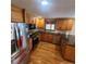 Kitchen with stainless steel appliances, wooden cabinets, and granite counter tops at 976 Bakers Bridge Rd, Douglasville, GA 30134