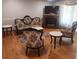 Inviting living room featuring hardwood floors, cozy seating, and a charming fireplace at 976 Bakers Bridge Rd, Douglasville, GA 30134