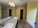 Bright primary bathroom with double vanity, walk-in shower, soaking tub and ample counter space at 102 Daisy Cir, Mcdonough, GA 30252