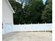 The backyard is fenced and has plenty of room for outdoor activities at 112 Village Ct, Woodstock, GA 30188