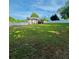 Large backyard with a white fence, offering privacy and space for recreation at 112 Village Ct, Woodstock, GA 30188