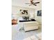 Cozy bedroom featuring a comfortable bed, soft rug, and stylish decor at 112 Village Ct, Woodstock, GA 30188