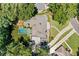 Aerial view of the property showcasing the pool, patio, landscaping, and layout of the home at 3146 Frontenac Ne Ct, Atlanta, GA 30319