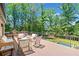 Spacious deck featuring lounge seating, swing chairs, and a great view of the backyard at 3146 Frontenac Ne Ct, Atlanta, GA 30319