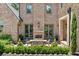 Brick home featuring an outdoor dining patio with a fireplace, offering a cozy and stylish entertaining space at 3146 Frontenac Ne Ct, Atlanta, GA 30319