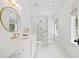 Bright bathroom with white marble and gold finishes, including a luxurious shower and stylish fixtures at 3146 Frontenac Ne Ct, Atlanta, GA 30319