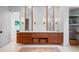 Elegant bathroom with double vanity, sleek wood cabinets, modern fixtures, and a stylish rug at 3146 Frontenac Ne Ct, Atlanta, GA 30319