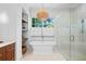 Bright bathroom with freestanding tub, glass shower, and stylish light fixture at 3146 Frontenac Ne Ct, Atlanta, GA 30319