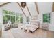 Bright bedroom with large windows, vaulted ceilings, wood beams, and a decorative chandelier at 3146 Frontenac Ne Ct, Atlanta, GA 30319