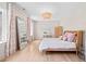 Bedroom with a large window, luxury chandelier, large mirror, and a bed with pink pillows at 3146 Frontenac Ne Ct, Atlanta, GA 30319