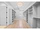 Spacious walk-in closet with custom shelving and drawers for optimal storage at 3146 Frontenac Ne Ct, Atlanta, GA 30319