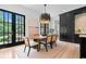 Elegant dining room with natural light, stylish chandelier, and access to the backyard at 3146 Frontenac Ne Ct, Atlanta, GA 30319