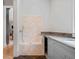 Convenient tiled dog wash station with granite counters, built-in bowls, and stainless-steel fixtures at 3146 Frontenac Ne Ct, Atlanta, GA 30319
