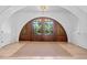 Elegant foyer featuring hardwood floors, arched doorway, and views of the front yard at 3146 Frontenac Ne Ct, Atlanta, GA 30319