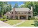 Stunning brick home featuring a sprawling lawn, stone pathway and inviting covered porch at 3146 Frontenac Ne Ct, Atlanta, GA 30319