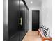 Hallway featuring elegant black storage cabinets and a cozy seating area with accent pillows at 3146 Frontenac Ne Ct, Atlanta, GA 30319