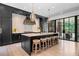 Modern kitchen with black cabinetry, marble countertops, and a large center island with seating at 3146 Frontenac Ne Ct, Atlanta, GA 30319