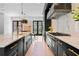 Gourmet kitchen with stainless steel appliances, marble backsplash and a view to the dining area at 3146 Frontenac Ne Ct, Atlanta, GA 30319