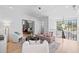 Upstairs living area with plush seating, a modern chandelier, and black framed windows with backyard views at 3146 Frontenac Ne Ct, Atlanta, GA 30319