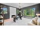 Sophisticated home office with modern lighting, marble fireplace, and bright natural light at 3146 Frontenac Ne Ct, Atlanta, GA 30319
