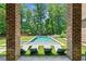 Beautiful backyard pool with modern lounge chairs and lush landscaping at 3146 Frontenac Ne Ct, Atlanta, GA 30319