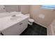Clean bathroom features a modern vanity with black tile floor at 3679 Seabass Rd, Decatur, GA 30034