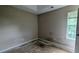 Bedroom features a tray ceiling and a window providing natural light at 3679 Seabass Rd, Decatur, GA 30034