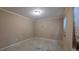 Empty bedroom with damaged walls, dirty carpet, and a window with blinds at 3679 Seabass Rd, Decatur, GA 30034