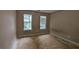 A bedroom featuring two windows at 3679 Seabass Rd, Decatur, GA 30034