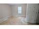 Bedroom features a window and a door providing ample natural light at 3679 Seabass Rd, Decatur, GA 30034