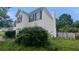 Side view of vinyl sided house with chimney, front windows and lawn at 3679 Seabass Rd, Decatur, GA 30034