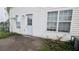 Side view of a vinyl sided house with a door and two windows at 3679 Seabass Rd, Decatur, GA 30034