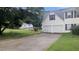 Spacious two-car garage and driveway with side view of house at 3679 Seabass Rd, Decatur, GA 30034