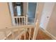 Bright hallway featuring paneled doors and white painted railing at 3679 Seabass Rd, Decatur, GA 30034