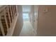 Hallway with carpet and view of a light fixture through the doorway at 3679 Seabass Rd, Decatur, GA 30034