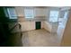 Kitchen featuring white cabinets and a black dishwasher along the countertops at 3679 Seabass Rd, Decatur, GA 30034