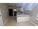 Kitchen featuring white cabinets, black appliances, and light granite countertops at 3679 Seabass Rd, Decatur, GA 30034