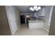 Bright kitchen with white cabinets, modern lighting, and gray countertops at 3679 Seabass Rd, Decatur, GA 30034