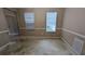 Empty room with two windows and blank walls, prepped for renovation at 3679 Seabass Rd, Decatur, GA 30034
