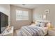 Serene bedroom with natural light and minimalist decor creates a restful ambiance at 6114 Leverett Dr, Lithonia, GA 30038