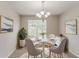 Cozy dining room features natural light and comfortable seating for a pleasant dining experience at 6114 Leverett Dr, Lithonia, GA 30038