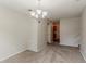 Inviting dining room with modern light fixture is ready for entertaining at 6114 Leverett Dr, Lithonia, GA 30038