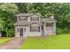 Charming two-story home features a front porch, manicured lawn, and welcoming curb appeal at 6114 Leverett Dr, Lithonia, GA 30038