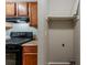 Laundry area with built-in shelf conveniently located near the kitchen at 6114 Leverett Dr, Lithonia, GA 30038